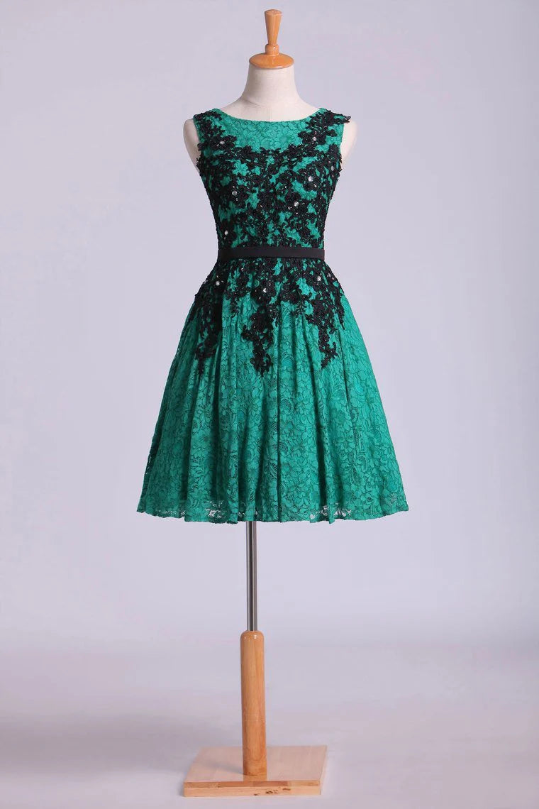 A-line matching black stickers and ribbon beaded mini dress