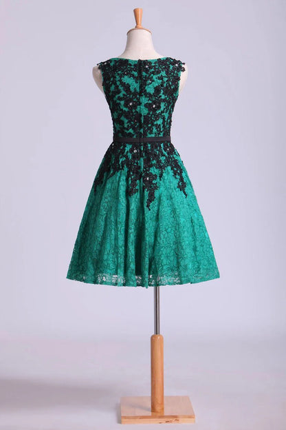 A-line matching black stickers and ribbon beaded mini dress